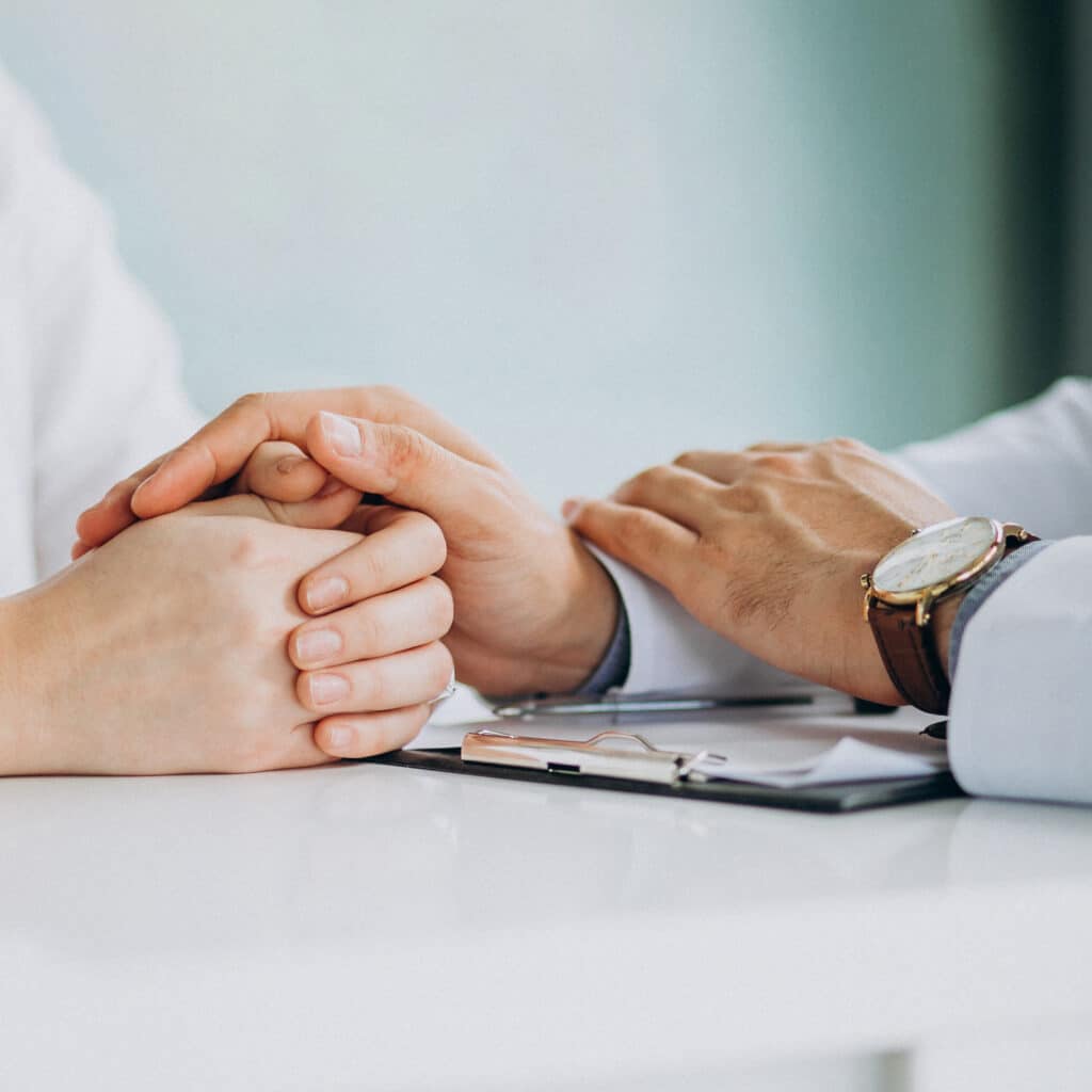 Physician consulting his patient at clinic