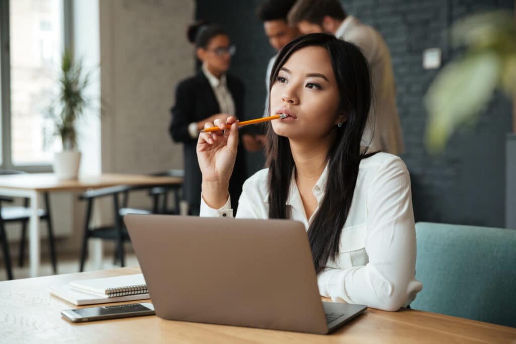 Thoughtful young asian business woman