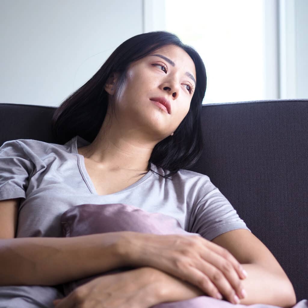 Asian women sitting on the couch